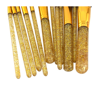 A set of makeup brushes in a Crystal gold tube 12pcs